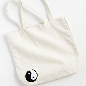 UO Distressed Yin Yang Tote Bag